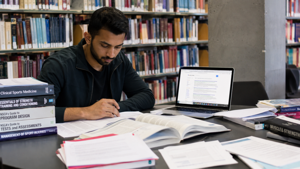 student conducting academic research using scholarly sources